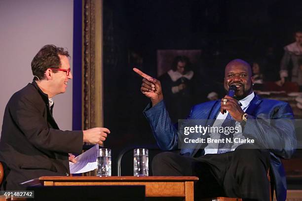 Event moderator Paul Holdengraber and former professional basketball player/author Shaquille O'Neal speak on stage during LIVE from the NYPL:...