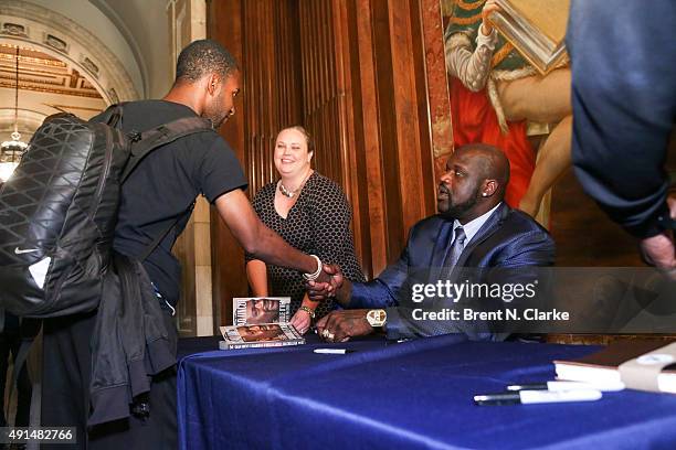 Former professional basketball player/author Shaquille O'Neal greets fans during LIVE from the NYPL: Shaquille O'Neal held at the New York Public...