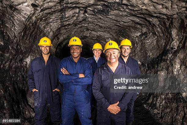 group of miners working at the mine - miner helmet portrait stock pictures, royalty-free photos & images