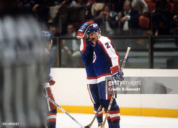 Moe Mantha of the Winnipeg Jets celebrates with teammates during an NHL game against the New York Islanders on October 25, 1983 at the Nassau...