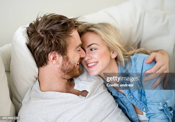 loving couple relaxing at home - cute girlfriends stock pictures, royalty-free photos & images