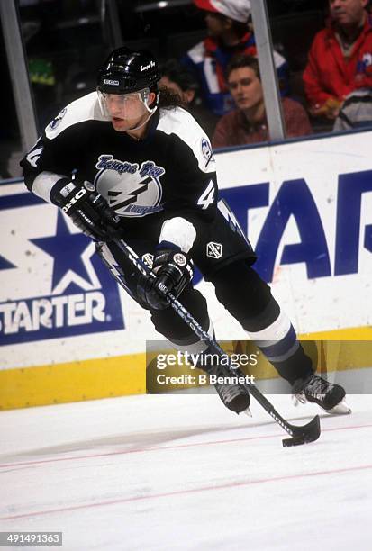 Roman Hamrlik of the Tampa Bay Lightning skates with the puck during an NHL game against the New York Rangers on November 8, 1995 at the Madison...