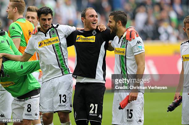 Lars Stindl, Tobias Sippel and Alvaro Dominguez of Borussia Moenchengladbach celebrate after the Bundesliga match between Borussia Moenchengladbach...