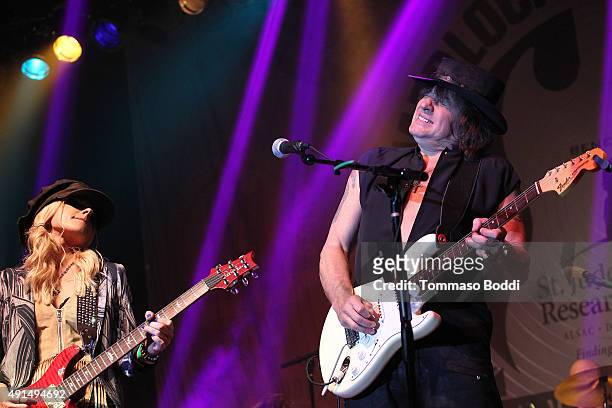 Musicians Orianthi and Richie Sambora perform on stage during the Medlock Krieger Celebrity Golf Invitational 2015 - All Star Concert held at...