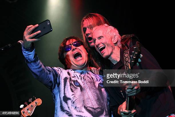 Musicians Jack Black, Sebastian Bach and Robby Krieger take a selfie on stage during the Medlock Krieger Celebrity Golf Invitational 2015 - All Star...