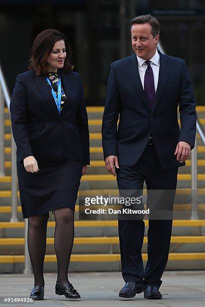 British Prime Minister David Cameron and Caroline Ansell, MP for Eastbourne and Willingdon walk through Manchester Central on the third day of the...