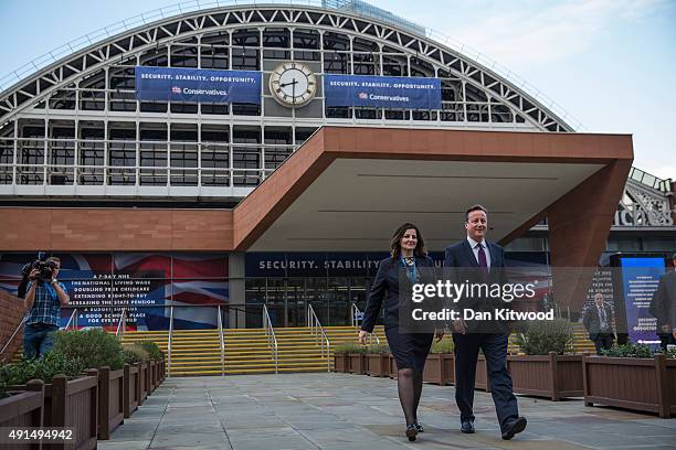 British Prime Minister David Cameron and Caroline Ansell, MP for Eastbourne and Willingdon walk through Manchester Central on the third day of the...