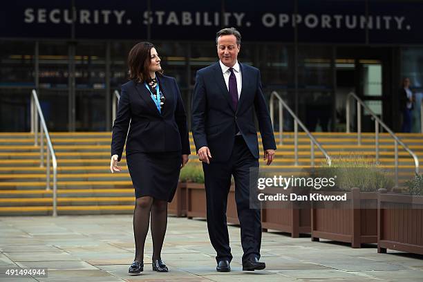 British Prime Minister David Cameron and Caroline Ansell, MP for Eastbourne and Willingdon walk through Manchester Central on the third day of the...