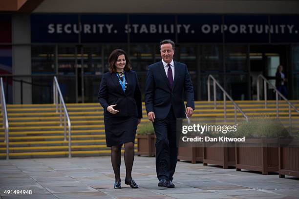 British Prime Minister David Cameron and Caroline Ansell, MP for Eastbourne and Willingdon walk through Manchester Central on the third day of the...