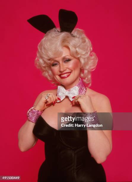 Country singer Dolly Parton poses for a portrait session dressed as a playboy bunny, 1978 in Los Angeles, California.