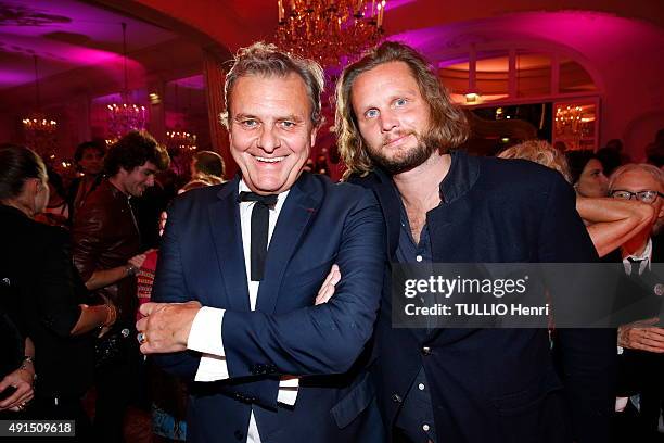 At the Pre Catelan evening to celebrate 50 years of career of the Japanese designer Kenzo Takada, Jean-Charles de Castelbajac with his son Guilhem on...