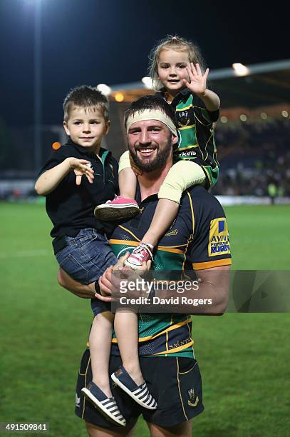 Tom Wood, who scored the match winning try for Northampton Saints, celebrates with his children Oliver and Isabella on their victory lap during the...