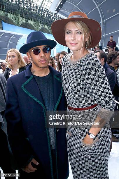 Formula One Racing Driver Lewis Hamilton and Tennis Player Maria Sharapova pose after the Chanel show as part of the Paris Fashion Week Womenswear...
