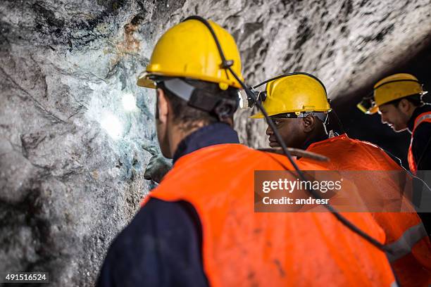 group of men working at a mine - miner pick stock pictures, royalty-free photos & images