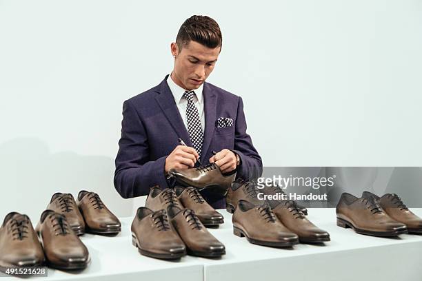 Cristiano Ronaldo signs 10 pairs of CR7 Footwear during the global launch of his FW15 collection. Each pair will be put in to circulation to be...
