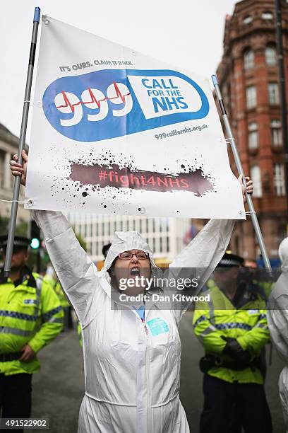 Protesters stage a 'Save the NHS' demonstration outside the Conservative party conference on October 6, 2015 in Manchester, England. Home Secretary...