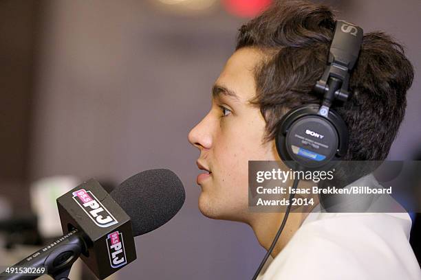 Singer Austin Mahone is interviewed backstage at Radio Row during the 2014 Billboard Music Awards at the MGM Grand Garden Arena on May 16, 2014 in...