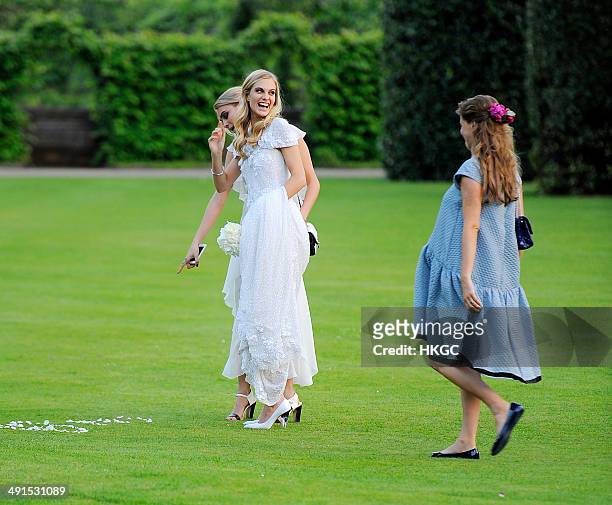 Chloe Delevingne, Poppy Delevingne and Cara Delevingne are seen at Poppy Delevingnes and James Cook's wedding reception held in Kensington Palace...