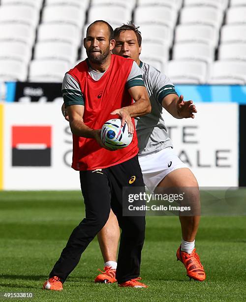 Fourie du Preez tackled by Coenie Oosthuizen during the South African national rugby team Captains Run and media conference at The Stadium, Queen...