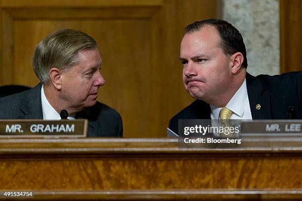 Senator Lindsey Graham, a Republican from South Carolina and 2016 presidential candidate, left, talks to Senator Michael "Mike" Lee, a Republican...