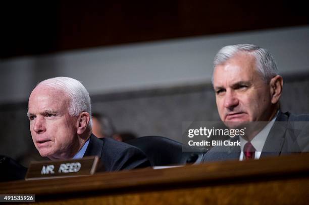 Chairman Sen. John McCain left, and ranking member Sen. Jack Reed listen as General John F. Campbell, Resolute Support Mission Commander in...
