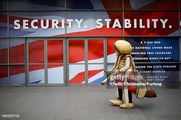 Person in a giant mosquito costume walks around Manchester Central to promote an anti-malaria campaign during the Conservative Party Conference on...