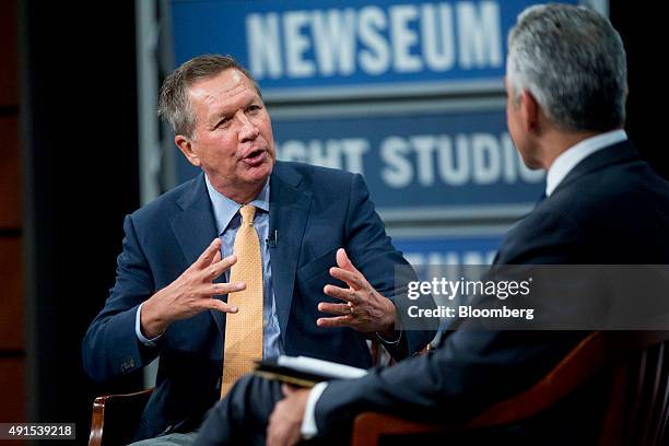 John Kasich, governor of Ohio and 2016 Republican presidential candidate, speaks with Javier Palomarez, president and chief executive officer of the...