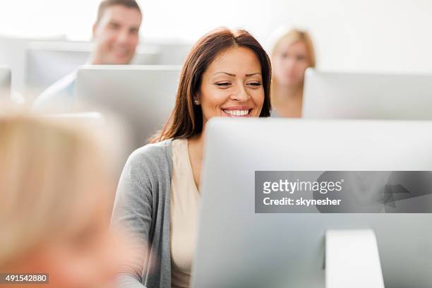 happy woman at computer class. - online seminar stock pictures, royalty-free photos & images