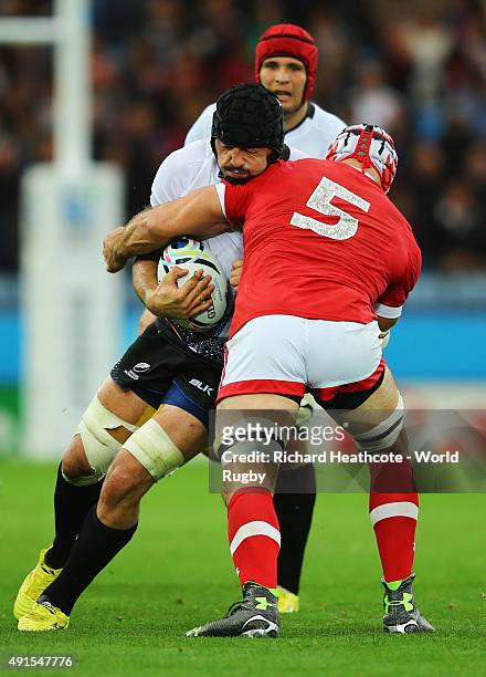 Valentin Poparlan of Romania is tackled Jamie Cudmore of Canada during the 2015 Rugby World Cup Pool D match between Canada and Romania at Leicester...
