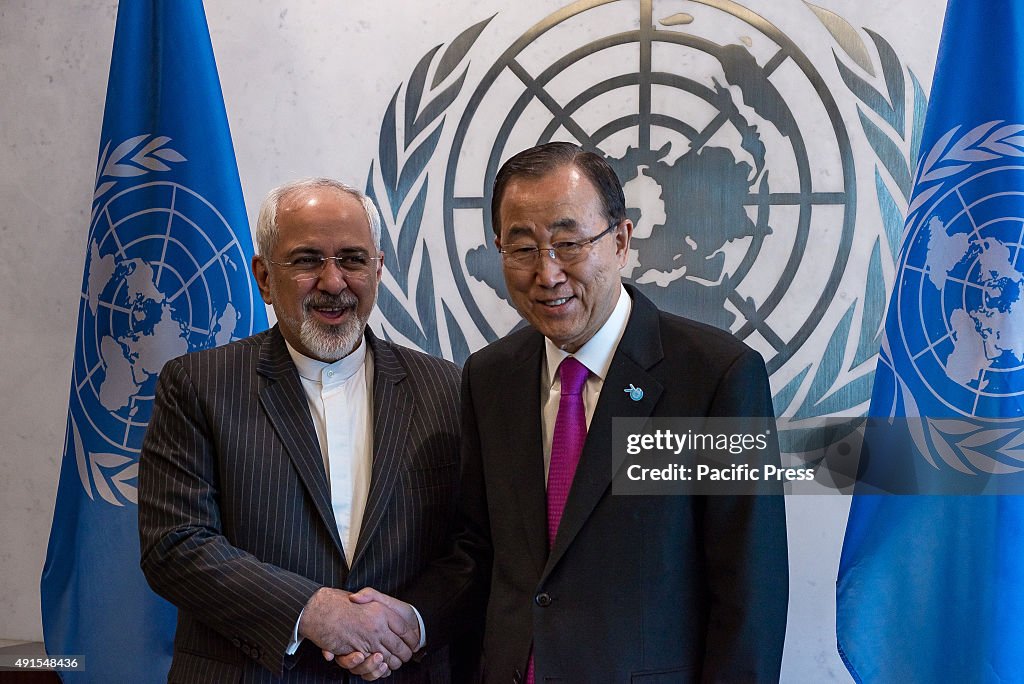 Secretary-General Ban Ki-moon (right) shakes hands with...