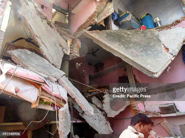 Building that collapsed after an unidentified blast in a house where 2 people were killed and many injured in Naini, Allahabad.