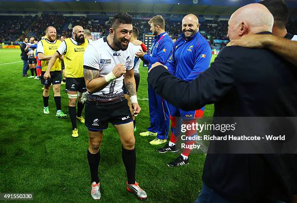 Lynn Howells, Head Coach of Romania celebrates victory with Florin Vlaicu of Romania after the 2015 Rugby World Cup Pool D match between Canada and...