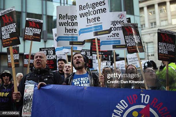 Stand Up To Racism' campaigners demonstrate outside the Conservative party conference on October 6, 2015 in Manchester, England. Home Secretary...