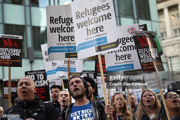 Stand Up To Racism' campaigners demonstrate outside the Conservative party conference on October 6, 2015 in Manchester, England. Home Secretary...