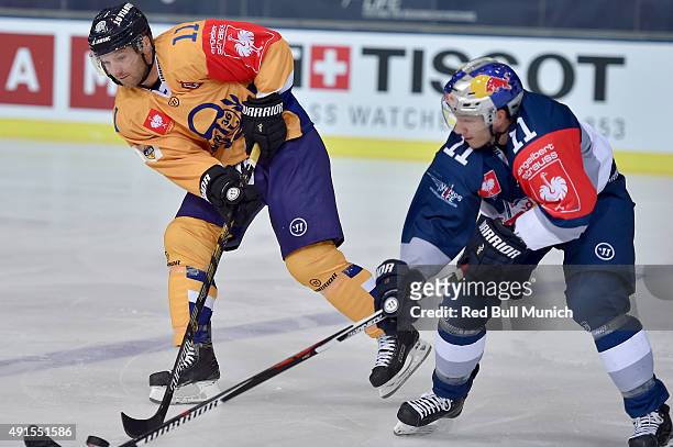 Aaron Gagnon of Lukko Rauma and Keith Aucoin of Red Bull Munich during the Champions Hockey League round of thirty-two game between Red Bull Munich...