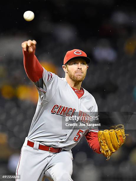 Collin Balester of the Cincinnati Reds throws to first base during the game against the Pittsburgh Pirates on October 2, 2015 at PNC Park in...