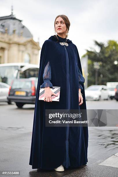 Isabell Hummel poses wearing a vintage cloack, Zara dress and Rafe clutch before the Chanel show at the Grand Palais during Paris Fashion Week SS16...