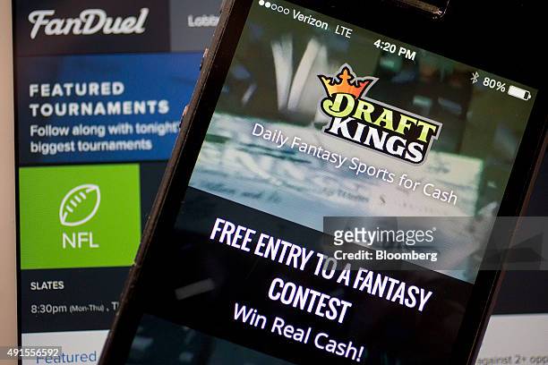 The DraftKings Inc. App and FanDuel Inc. Website are arranged for a photograph in Washington, D.C., U.S., on Monday, Oct. 5, 2015. Fantasy sports...