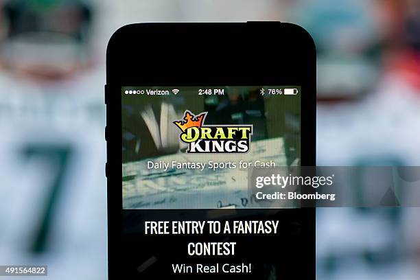 The DraftKings Inc. App is arranged for a photograph on an Apple Inc. IPhone in Washington, D.C., U.S., on Sunday, Oct. 4, 2015. Fantasy sports...