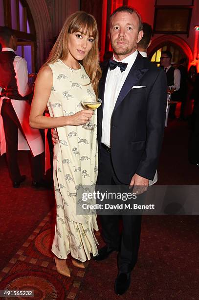 Jacqui Ainsley and Guy Ritchie attend a cocktail reception at the BFI Luminous Fundraising Gala in partnership with IWC and crystals by Swarovski at...