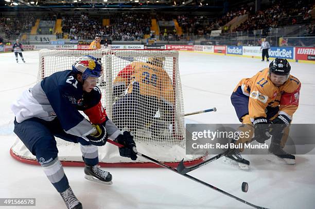 Dominik Kahun of Red Bull Munich, Ryan Zapolski and Aaron Gagnon of Lukko Rauma during the Champions Hockey League round of thirty-two game between...