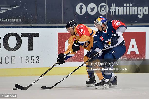 Aaron Gagnon of Lukko Rauma and Keith Aucoin of Red Bull Munich during the Champions Hockey League round of thirty-two game between Red Bull Munich...