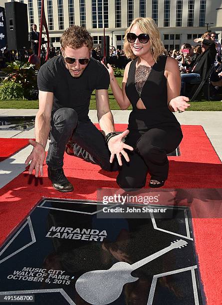 Singers Dierks Bentley, left, and Miranda Lambert pose with Lambert's star at the Nashville Music City Walk of Fame on October 6, 2015 in Nashville,...