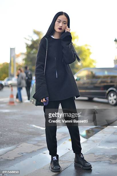 Model Jing Wen poses after the Shiatzy Chen show at the Grand Palais during Paris Fashion Week SS16 on October 6, 2015 in Paris, France.