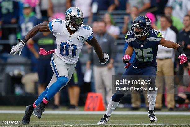 Wide receiver Calvin Johnson of the Detroit Lions in action against cornerback Cary Williams of the Seattle Seahawks at CenturyLink Field on October...