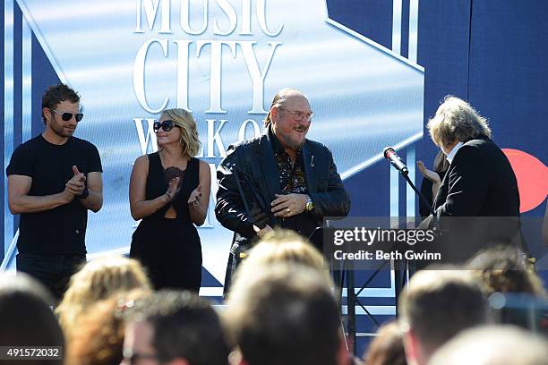 Steve Cropper receives his plague from Joe Chambers at Nashville Music City Walk of Fame on October 6, 2015 in Nashville, Tennessee.