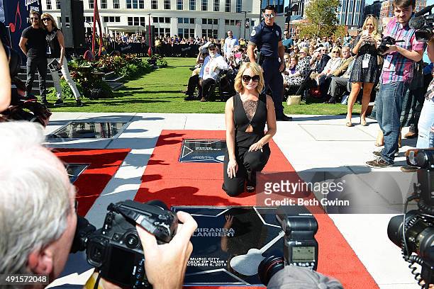 Miranda Lambert poses with her star at Nashville Music City Walk of Fame on October 6, 2015 in Nashville, Tennessee.