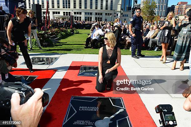 Miranda Lambert poses with her star at Nashville Music City Walk of Fame on October 6, 2015 in Nashville, Tennessee.