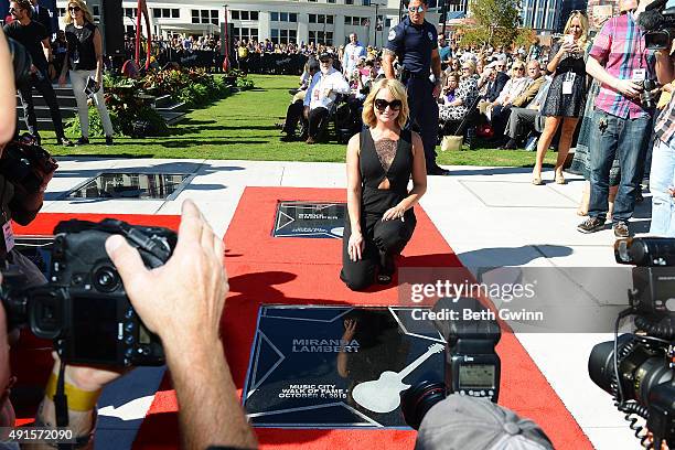 Miranda Lambert poses with her star at Nashville Music City Walk of Fame on October 6, 2015 in Nashville, Tennessee.