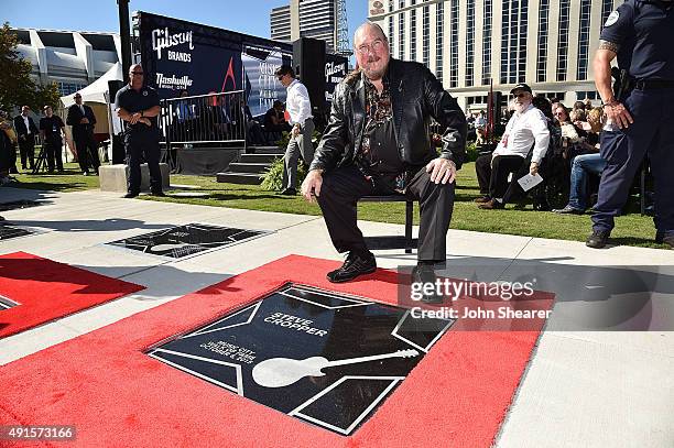 Musician Steve Cropper poses with his star at the Nashville Music City Walk of Fame on October 6, 2015 in Nashville, Tennessee.